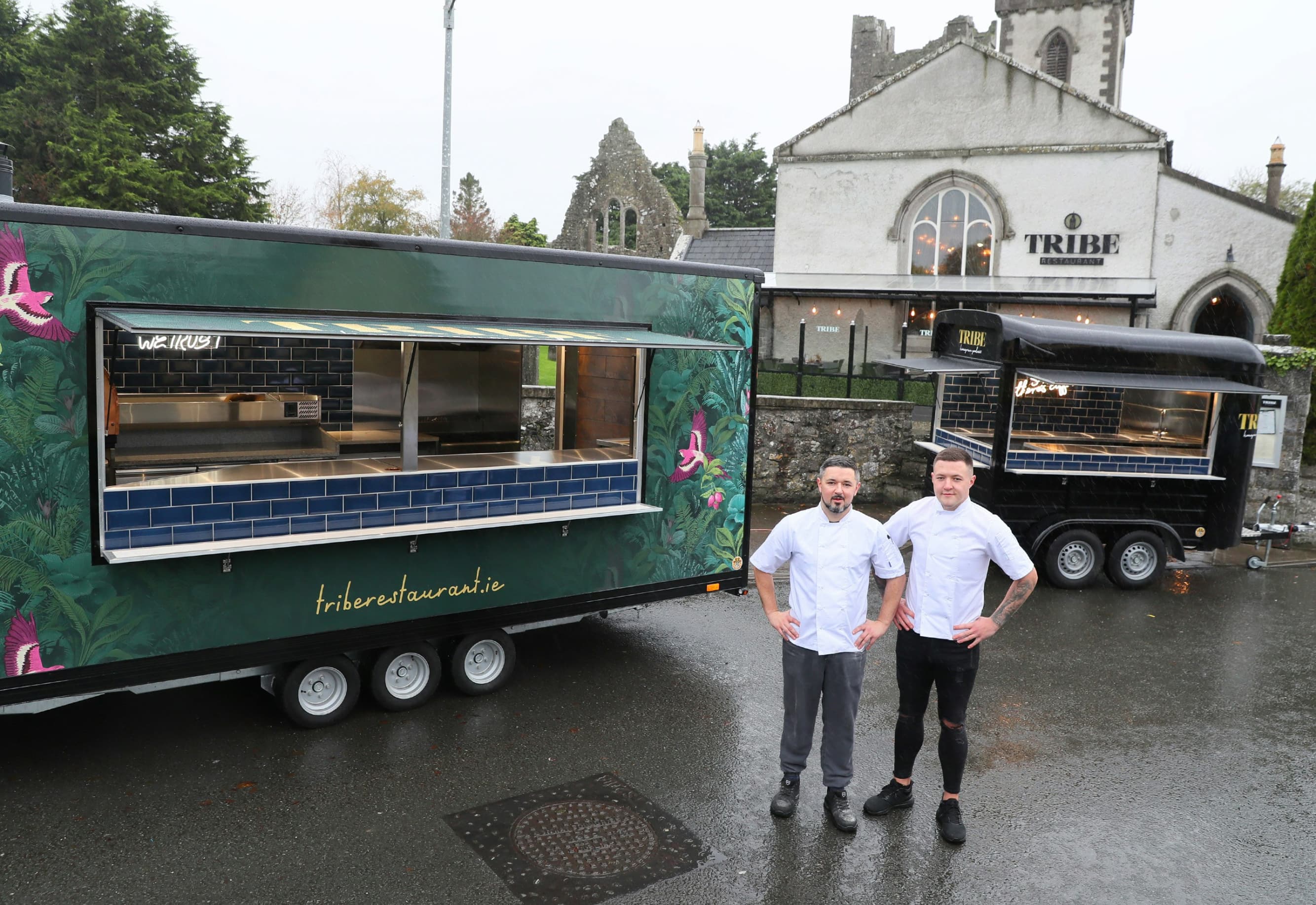Head chef with sous on the background of the restaurant kitchen