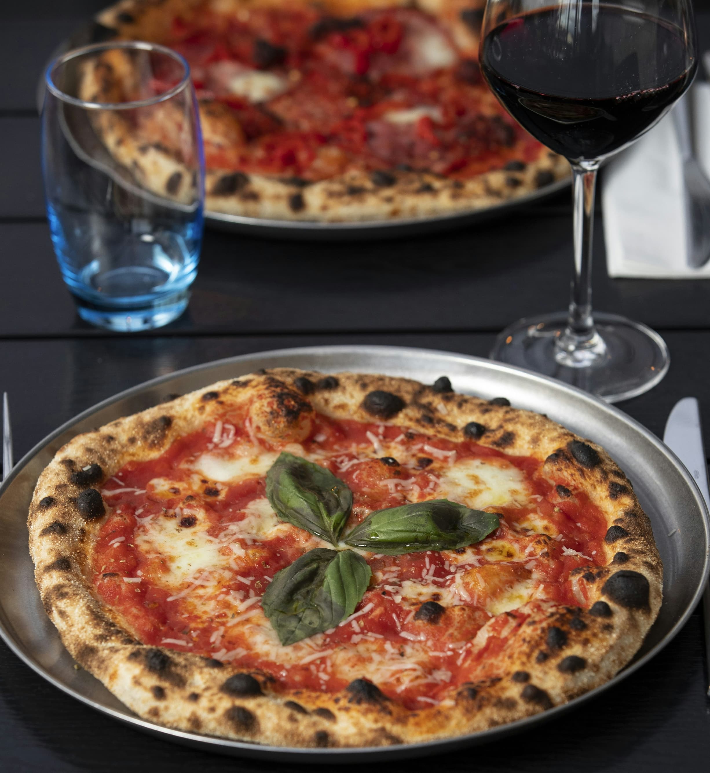 Signature wood-fired pizza with fresh toppings